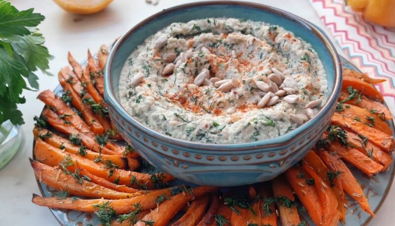 Crispy roasted sweet potato fries, garnished with fresh dill