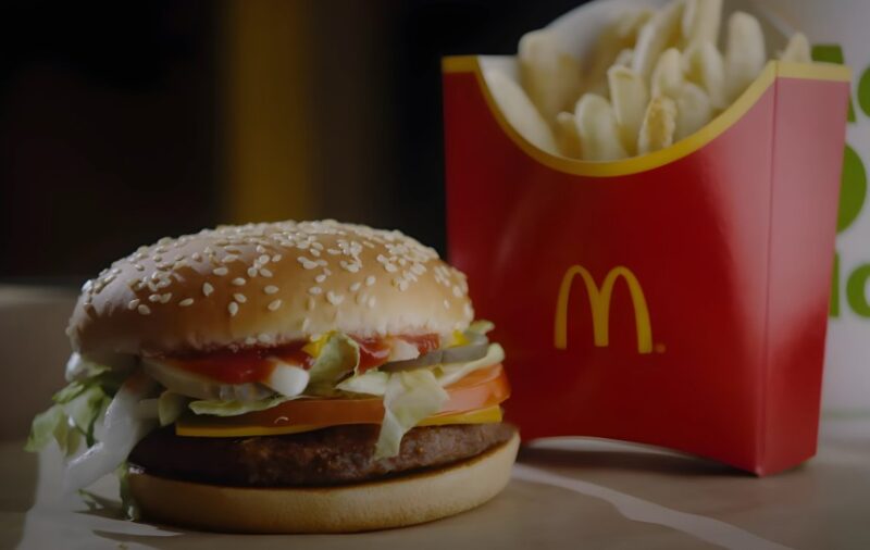 A classic McDonald's burger, topped with lettuce, tomato