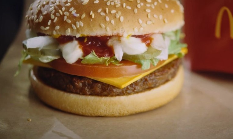 A juicy plant-based burger, topped with crisp lettuce