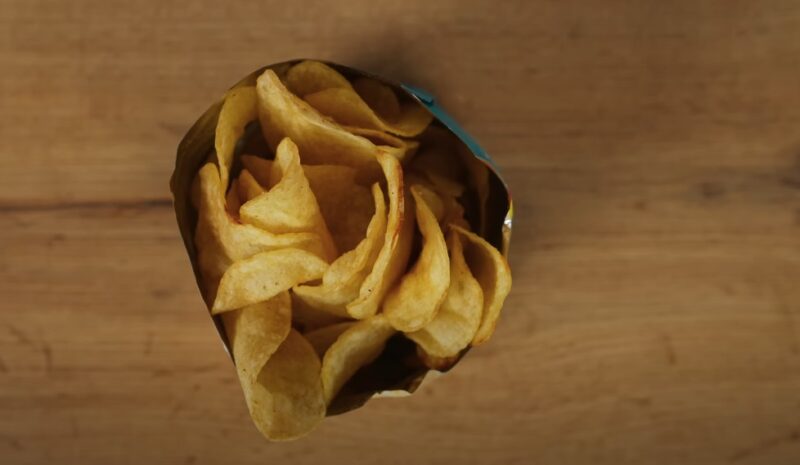 Crispy potato chips, nestled in a paper packet