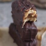 A stack of chocolate bars filled with creamy peanut butter