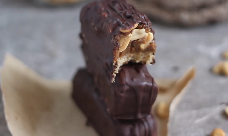 A stack of chocolate bars filled with creamy peanut butter