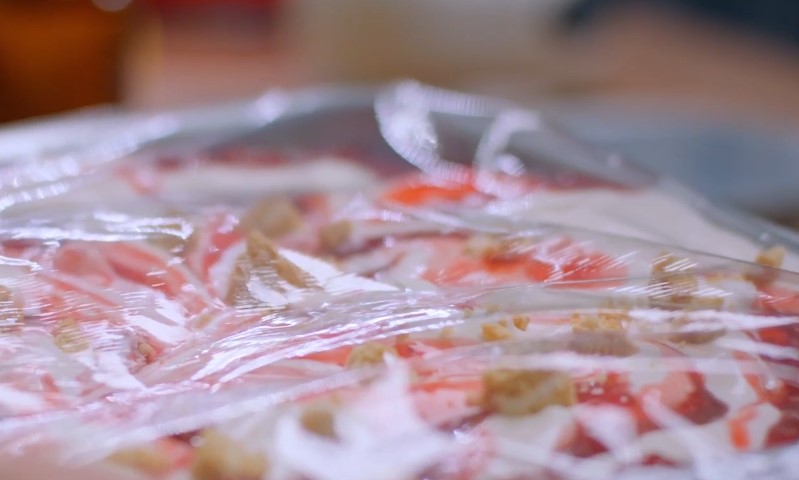 Cheesecake stored under a wrap paper