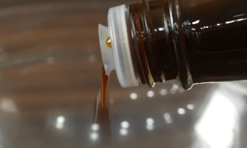 Worcestershire Sauce being poured into a glass bowl
