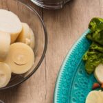Sliced hearts of palm on a plate and in a bowl, ready for simple prep and seasoning