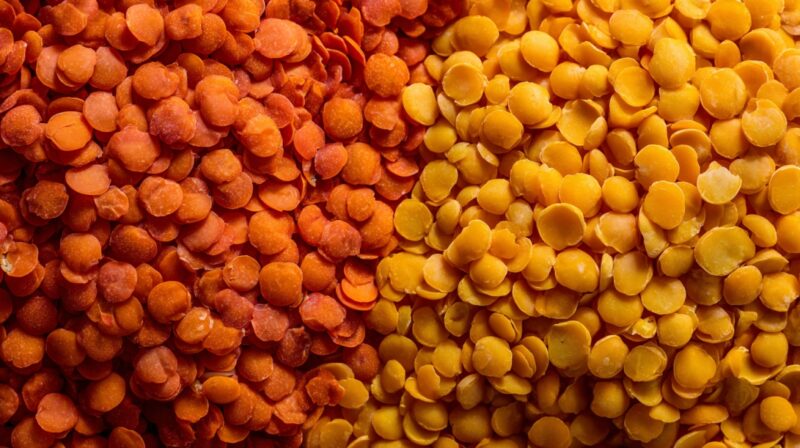 Close up of red and yellow lentils side by side